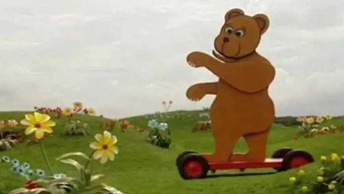 The fuzzy bear from the Teletubbies as she runs away from the lion in the uncensored version