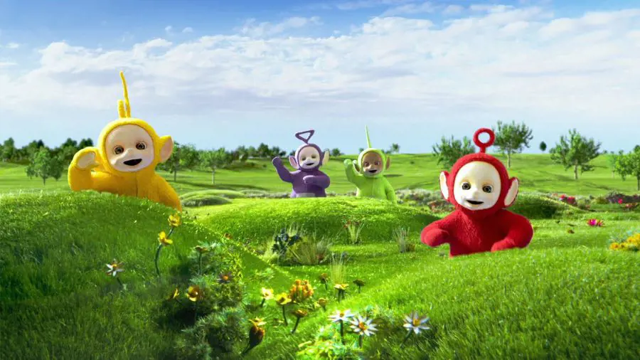 Teletubbies waving at their audience from their Teletubbyland