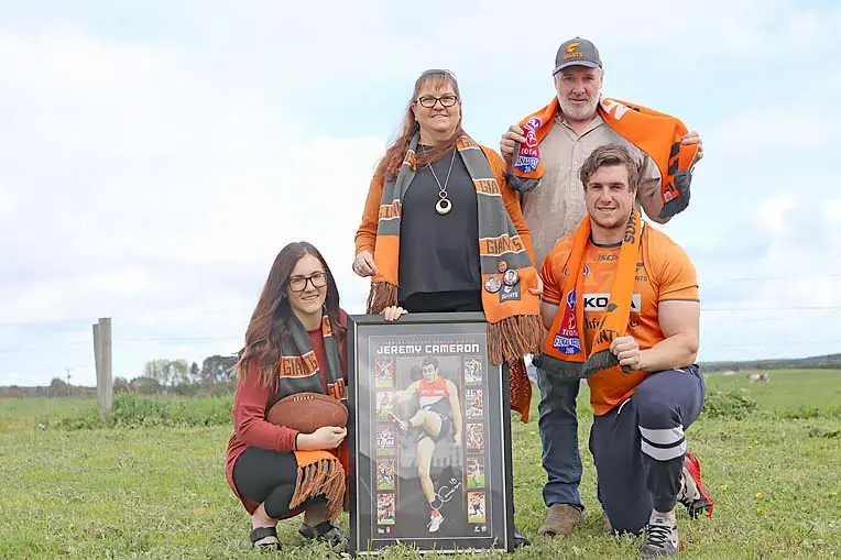 Jeremy Cameron with his whole family receiving the honors from GWS Giants Football Club.