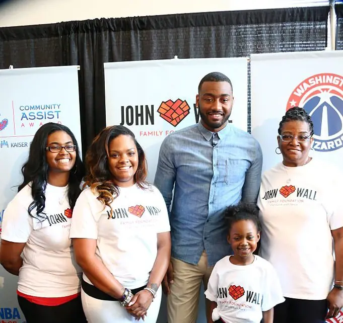 John Wall and family posing during their campaign for John Wall family Foundation.