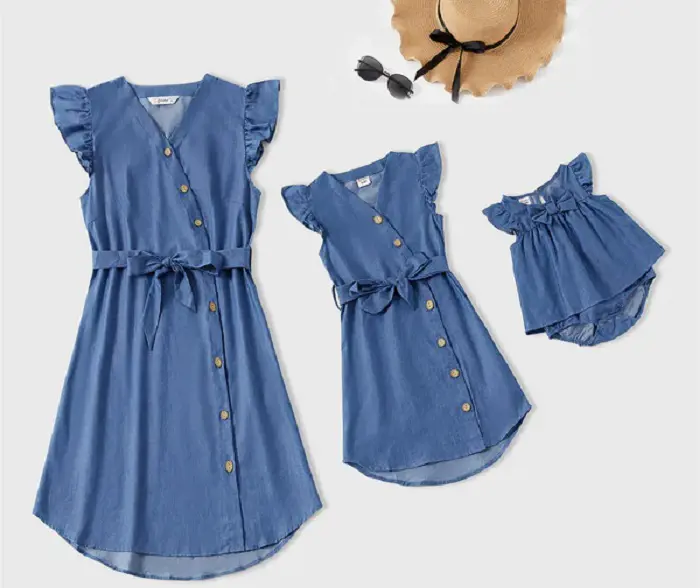A three person matching blue dress for mother and her two daughters. 
