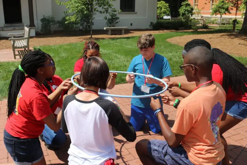 Kids participate in a hula hoop finger game