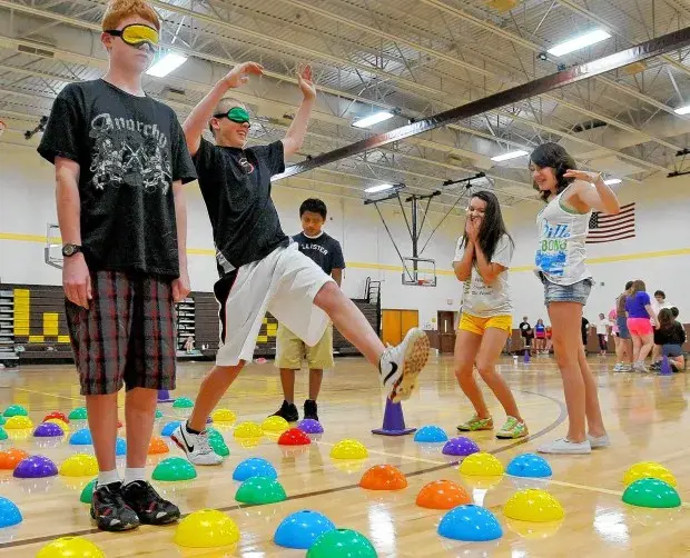 Teens play Minefield in a hall