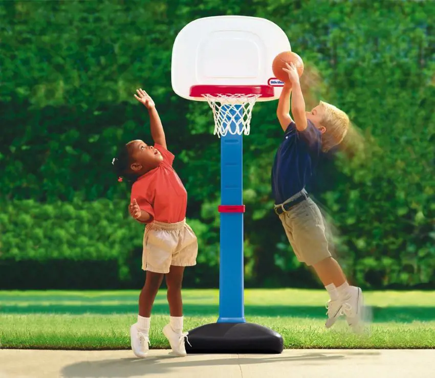 Children compete in a basketball game in an easy score set