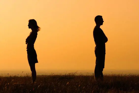Silhouette of couple being distant with each other