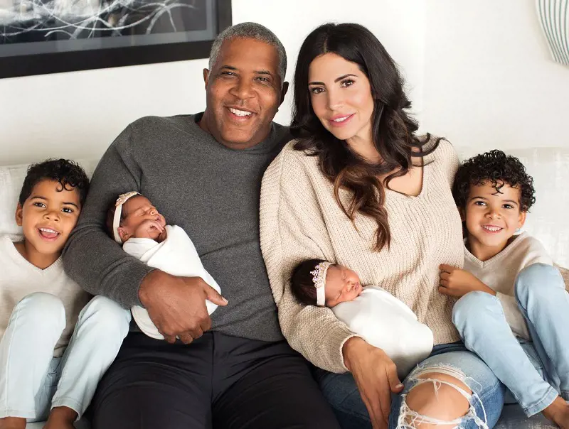Robert F Smith and his wife Hope Dworaczyk Smith pose for a family photograph with their two sons and newborn twin daughters