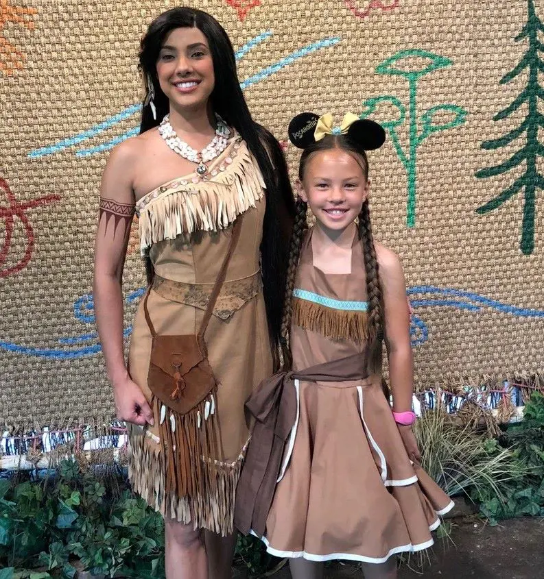 Mother and daughter dress up in matching Pocahontas dress