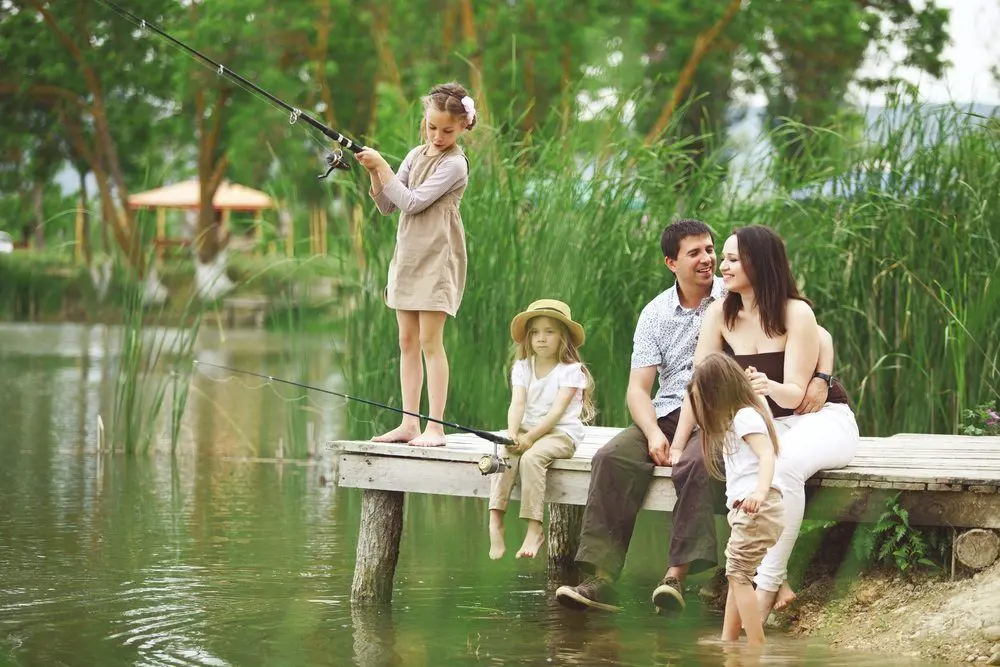 A family of five spend quality time together during their fishing trip