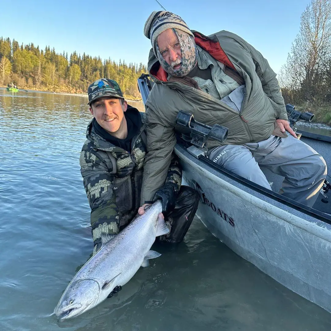 Two men catch King Salmon at Kasilof river in Alaska