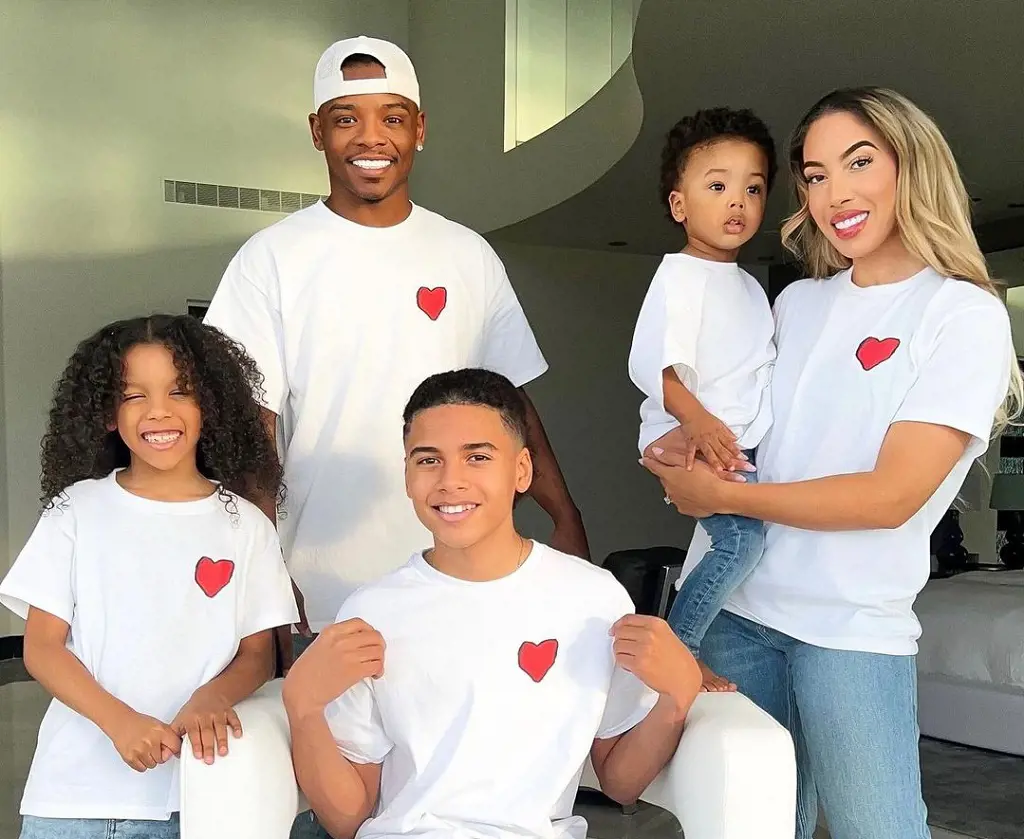 YouTuber Beverly Halls Family members (L-R) Mar'Cannon, Marco, Braylon, Caedon, and Brooke, wear matching white tshirt with a red heart in front.