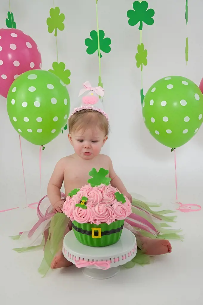 A baby girl celebrates her birthday in a clover flower themed design which looks super cool