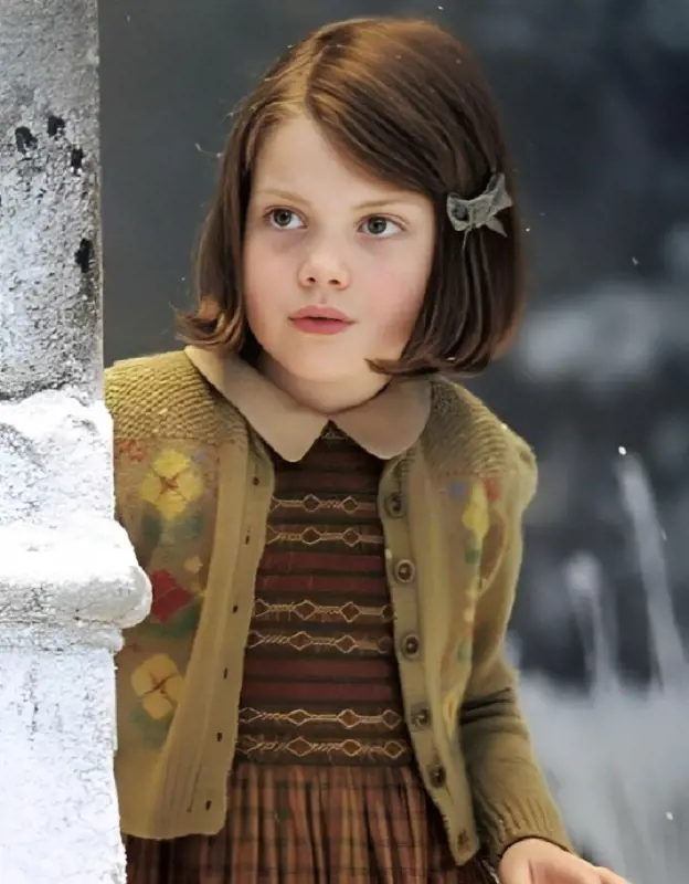 Actress Georgie Henley portraying Lucy Pevensie character in the first film of the series.