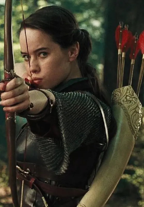 Anna Popplewell aims with her magical bow and arrow while portraying the character of Susan Pevensie in The Chronical of Narnia
