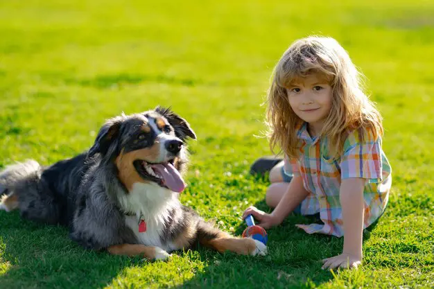 Young girl enjoying the outdoors with her pet dog