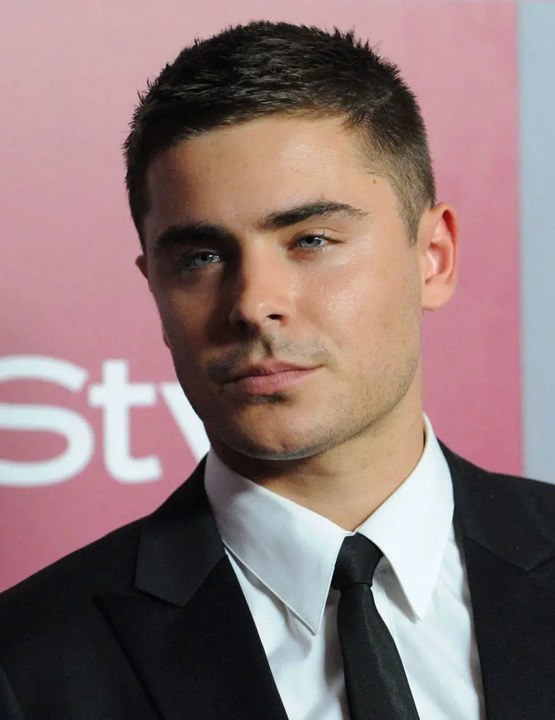 Zac Efron sports a Crew Cut attired in a suit