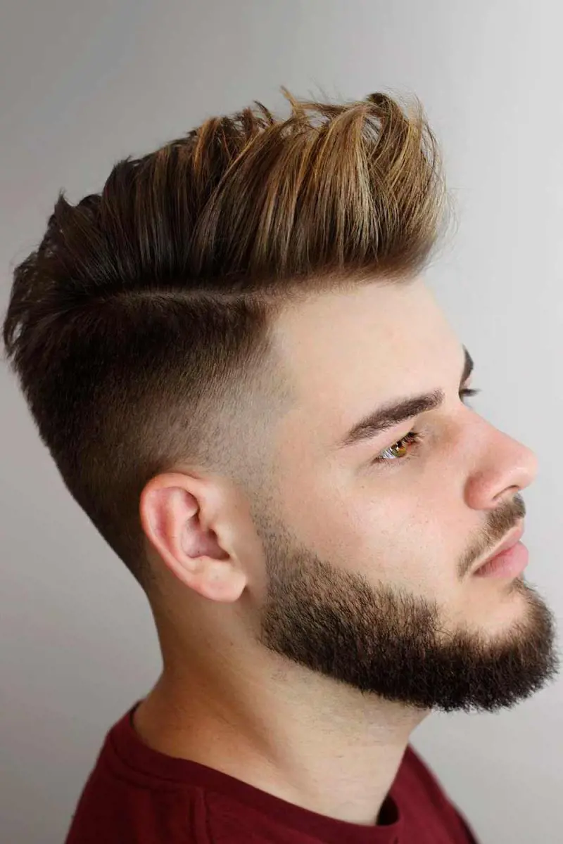 Faux Hawk haircut with tapered sides and long top hair