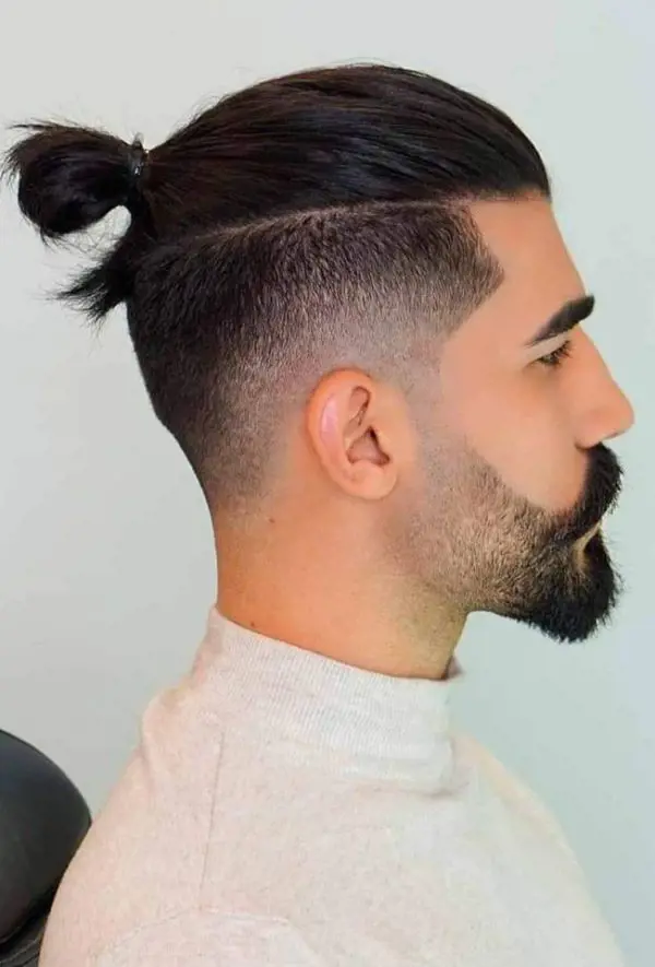 Man Bun hairstyle with Drop Fade and Disconnected Undercut