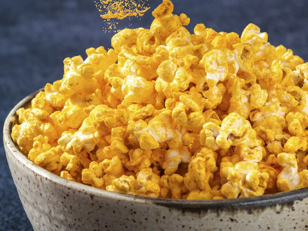 A bowl full of cheese popcorn