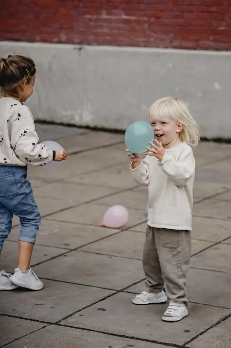 Cheerful girls playing the Balloon Bounce game
