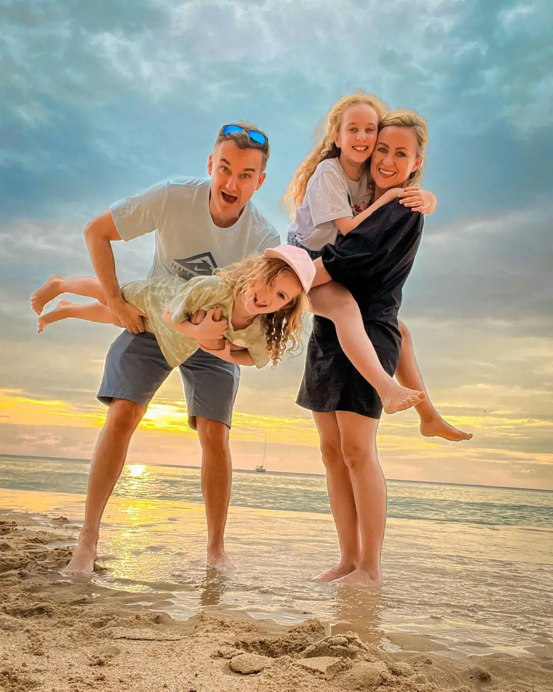 Natasha and Tom enjoy with their daughters at Naithon Beach, Phuket, Thailand, on December 19, 2022. 