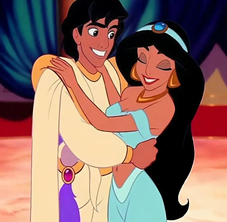 Aladdin and Jasmine embrace each other with a joyful expression