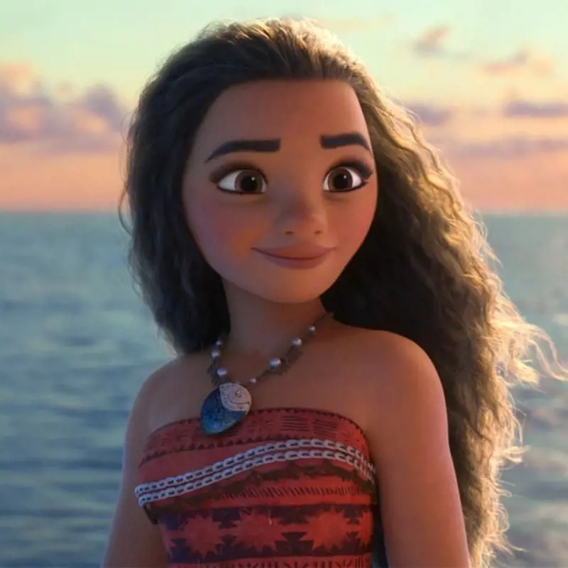 Moana attired in her tribal dress as she flaunts her dark curly hair