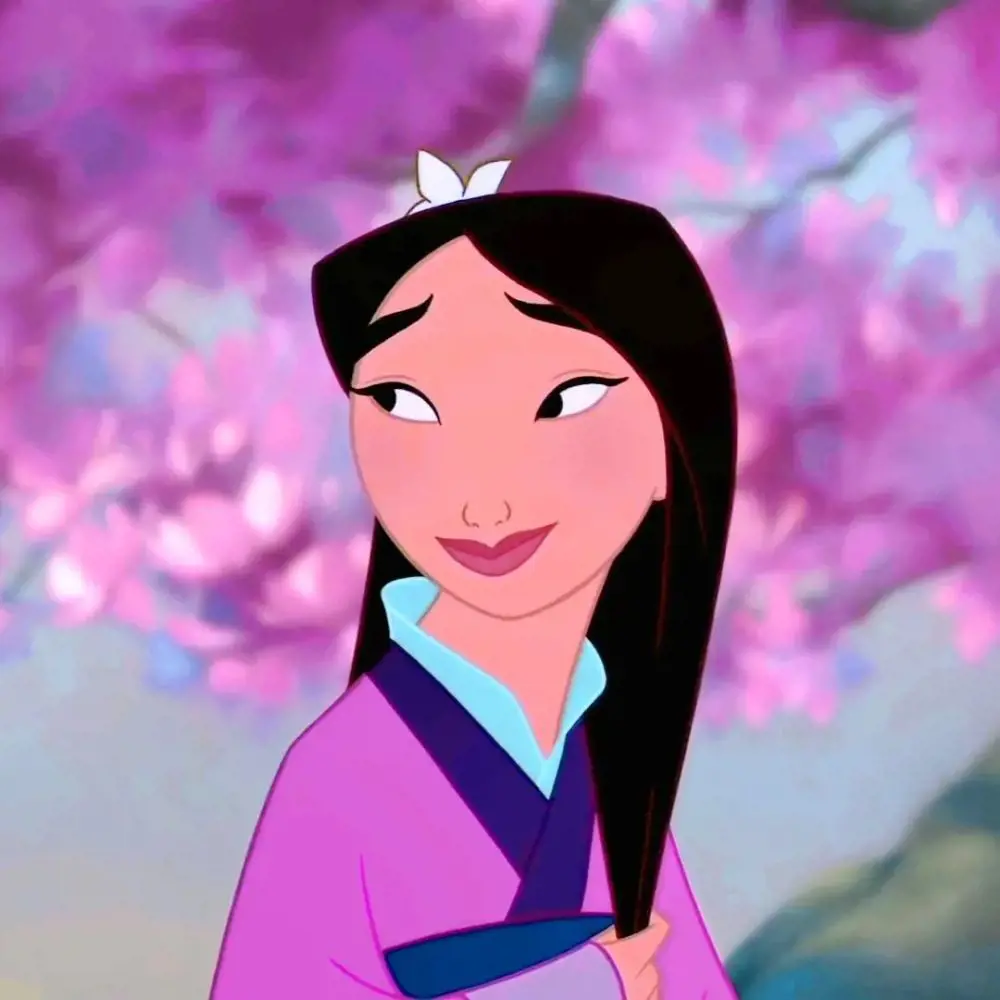 Mulan attired in a traditional outfit and flaunts her medium length hair