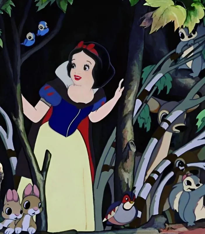Snow White attired in her classic dress as she is surrounded b y her beloved animals