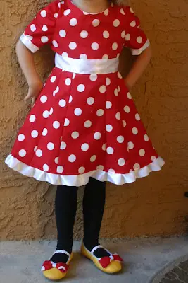 DIY Minnie Mouse Birthday Dress made with simple red cloth with white polka dots and white ribbons as belt. 